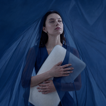MemoryOne Hybrid Pillow on blue bedding in morning light